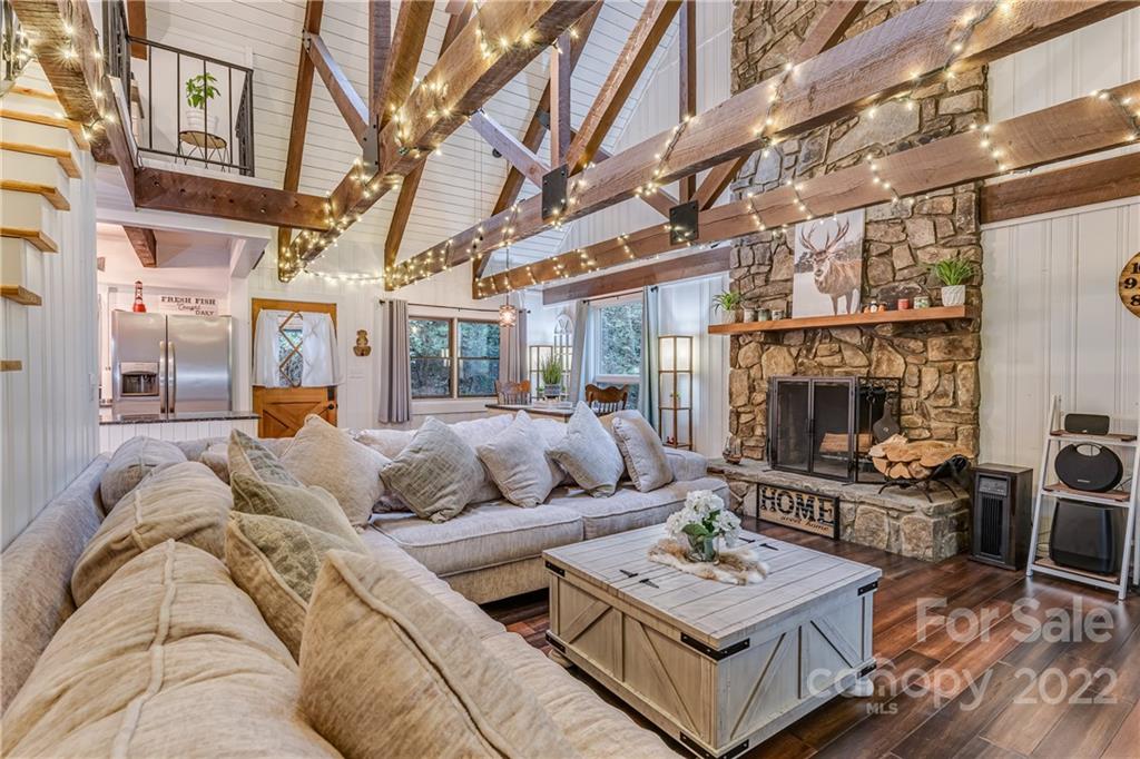 1305 Old Balsam Road Waynesville, NC 28786 - Photo 20 of 42 a living room with furniture and a fireplace