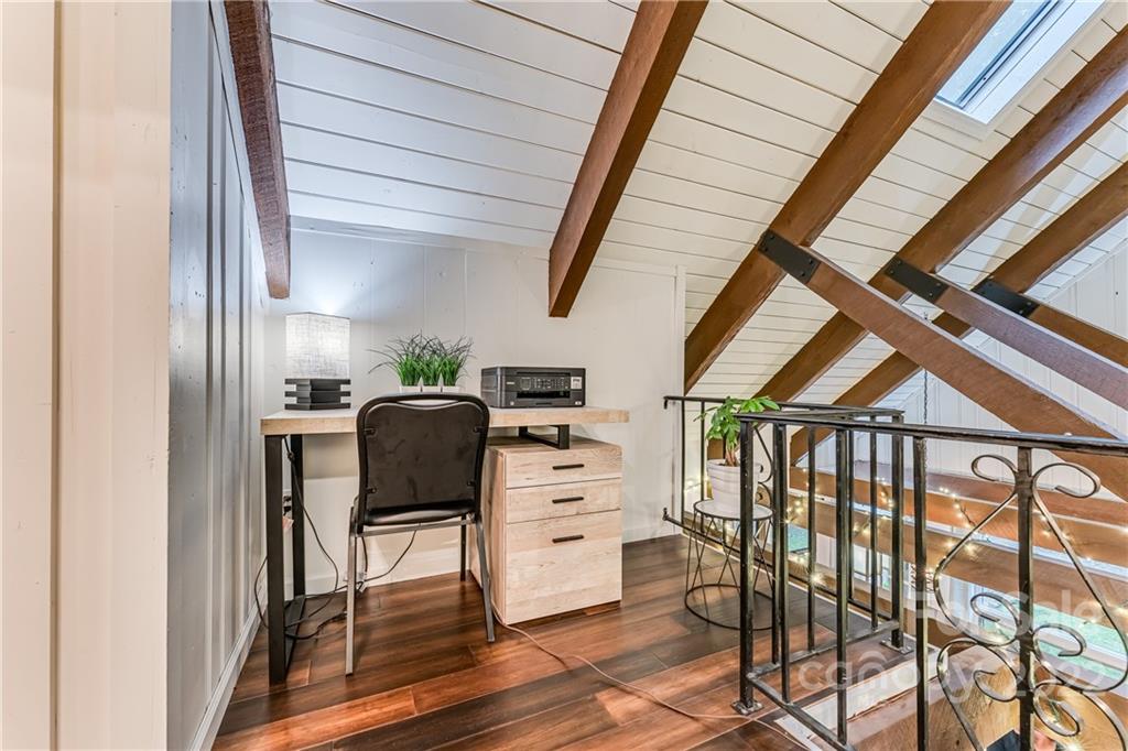 1305 Old Balsam Road Waynesville, NC 28786 - Photo 25 of 42 a view of a hallway with wooden floor windows and stairs