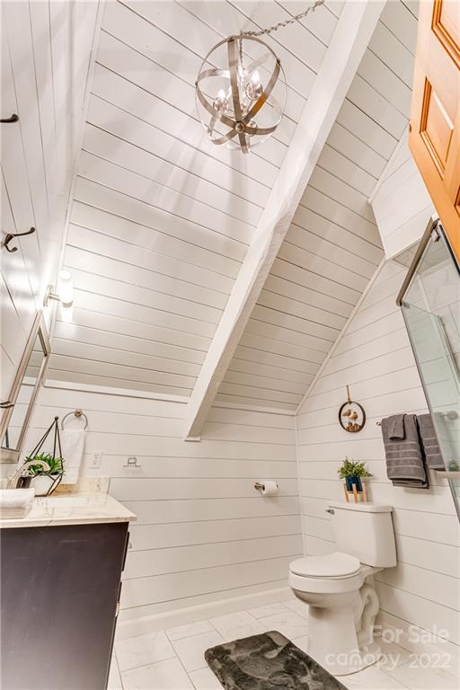 1305 Old Balsam Road Waynesville, NC 28786 - Photo 26 of 42 a bathroom with a sink a toilet and a mirror