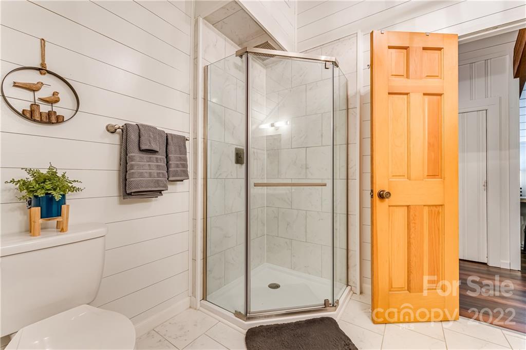 1305 Old Balsam Road Waynesville, NC 28786 - Photo 28 of 42 a bathroom with a shower and a sink