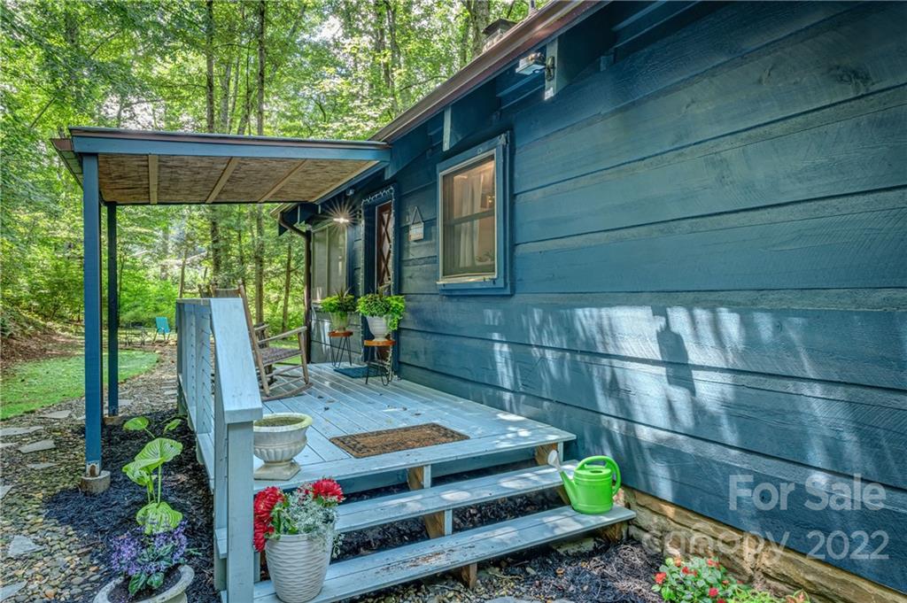 1305 Old Balsam Road Waynesville, NC 28786 - Photo 4 of 42 a view of backyard with outdoor seating and green space