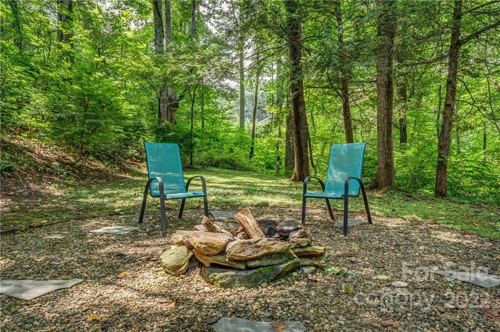 1305 Old Balsam Road Waynesville, NC 28786 - Photo 7 of 42 a view of a chairs in backyard of a house