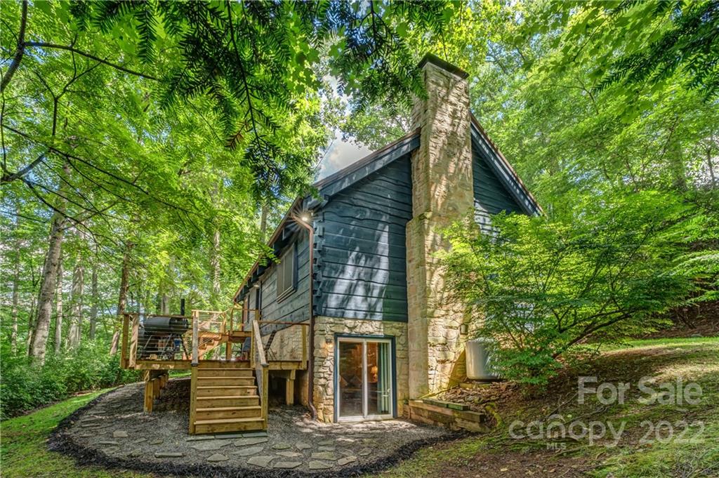 1305 Old Balsam Road Waynesville, NC 28786 - Photo 9 of 42 a view of house with yard