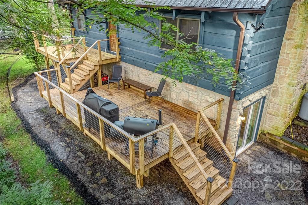 1305 Old Balsam Road Waynesville, NC 28786 - Photo 10 of 42 a view of a house with backyard and sitting area