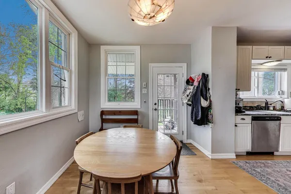 a view of a dining room with furniture and a window