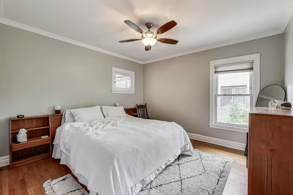 a bedroom with a large bed and a window