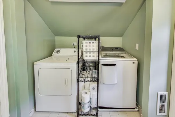 a utility room with dryer and washer