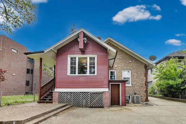 a front view of a house with a garage