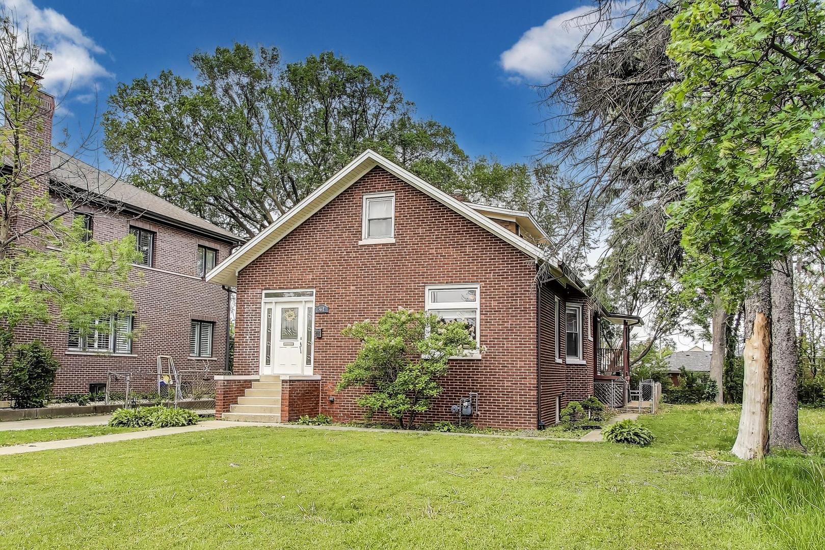 36 Touhy Avenue Park Ridge, IL 60068 - Photo 2 of 28 a front view of house with yard and green space