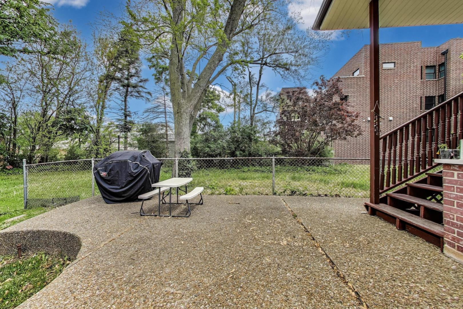 36 Touhy Avenue Park Ridge, IL 60068 - Photo 22 of 28 a view of a garden with a slide