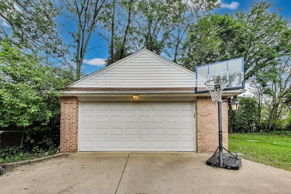 a view of garage and yard