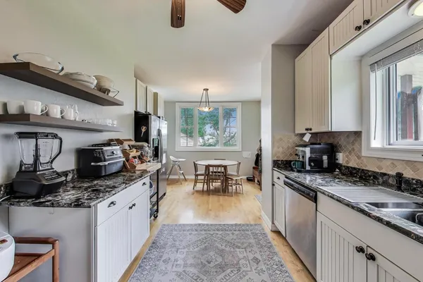 a kitchen with granite countertop lots of counter top space