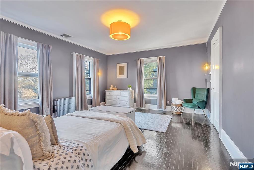 12 Harrison Avenue Montclair, NJ 07042 - Photo 15 of 34 a bedroom with a bed and glass windows