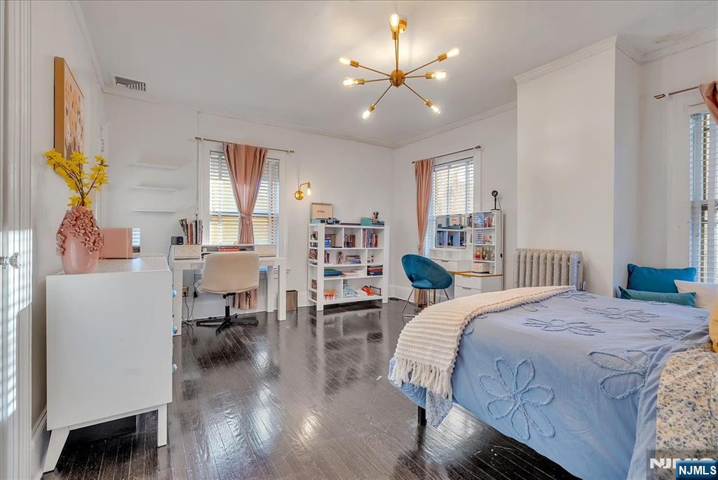 12 Harrison Avenue Montclair, NJ 07042 - Photo 16 of 34 a bedroom with a bed furniture and a chandelier