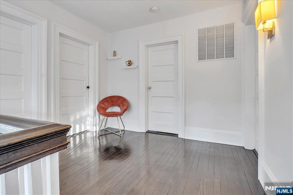 12 Harrison Avenue Montclair, NJ 07042 - Photo 20 of 34 a view of a room with wooden floor and furniture