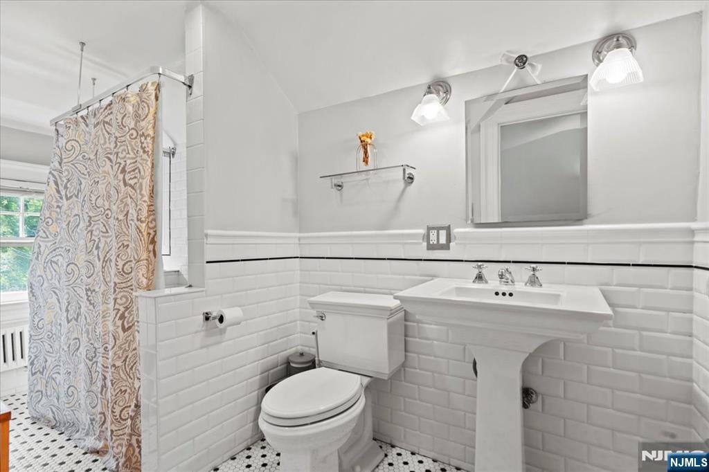 12 Harrison Avenue Montclair, NJ 07042 - Photo 21 of 34 a bathroom with a sink toilet and shower