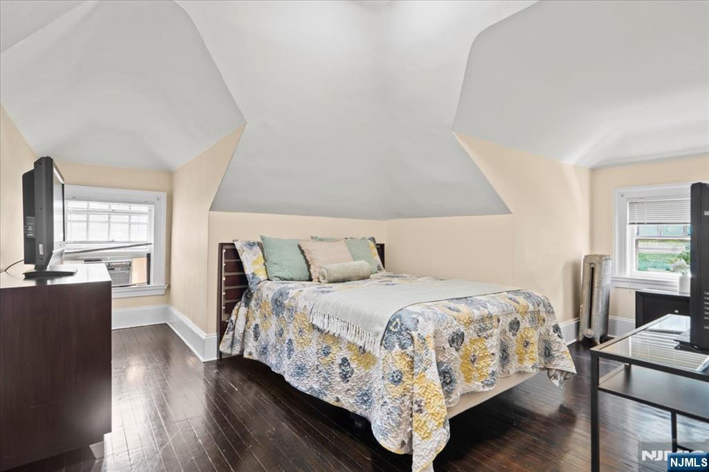 12 Harrison Avenue Montclair, NJ 07042 - Photo 22 of 34 a bedroom with a bed and wooden floor