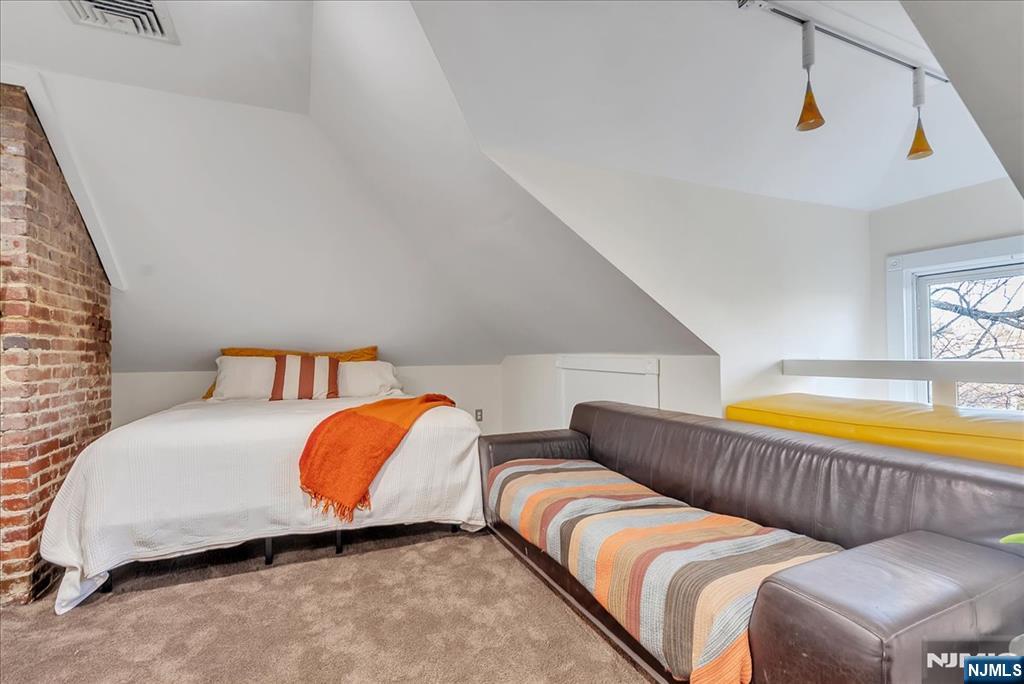 12 Harrison Avenue Montclair, NJ 07042 - Photo 23 of 34 a bedroom with two beds and a lamp