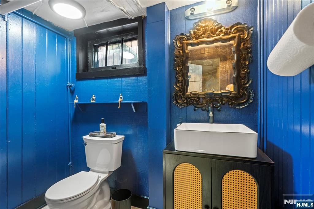 12 Harrison Avenue Montclair, NJ 07042 - Photo 24 of 34 a bathroom with a toilet a sink and mirror