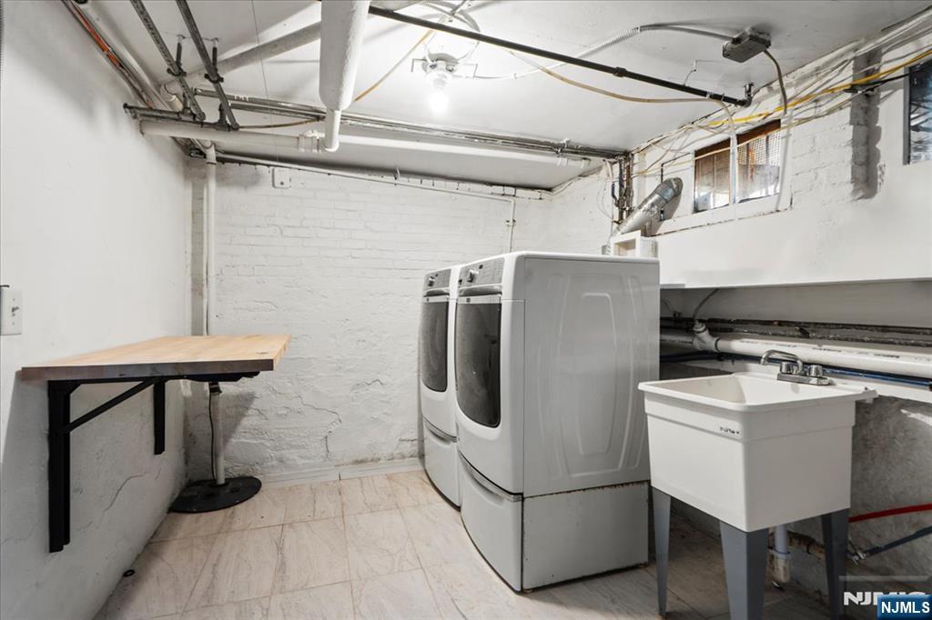 12 Harrison Avenue Montclair, NJ 07042 - Photo 25 of 34 a white refrigerator freezer sitting inside of a kitchen