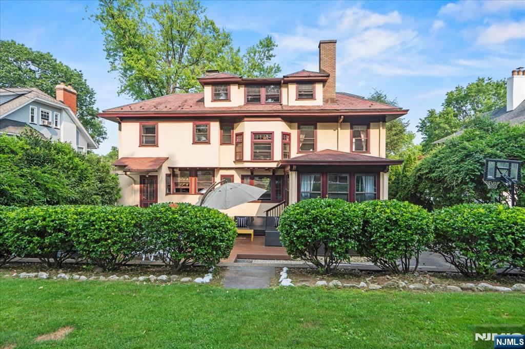 12 Harrison Avenue Montclair, NJ 07042 - Photo 27 of 34 a front view of a house with a yard