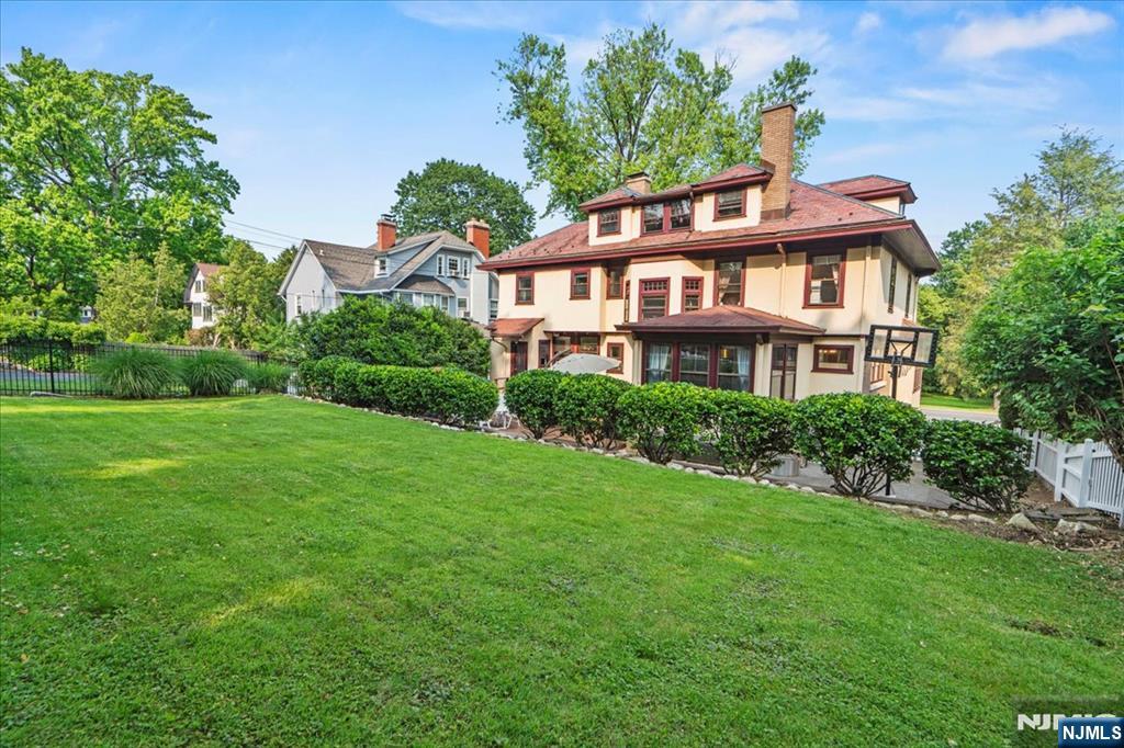 12 Harrison Avenue Montclair, NJ 07042 - Photo 28 of 34 a front view of a house with a yard