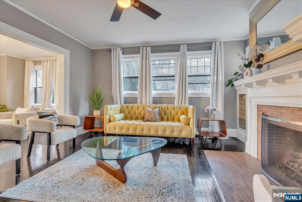 12 Harrison Avenue Montclair, NJ 07042 - Photo 7 of 34 a living room with furniture and a fireplace