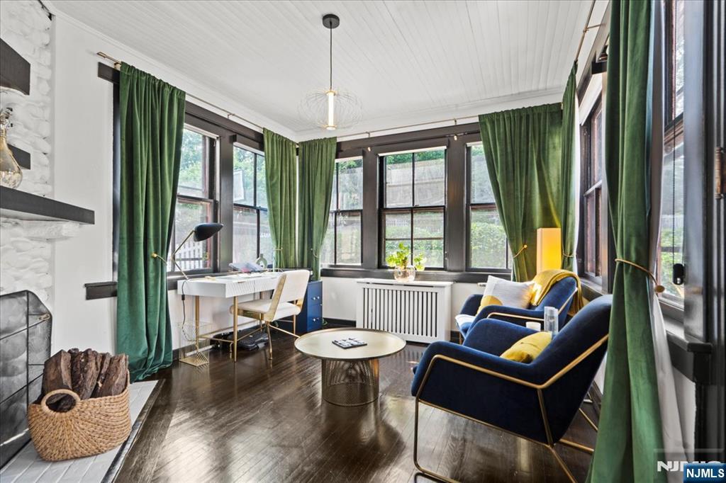 12 Harrison Avenue Montclair, NJ 07042 - Photo 9 of 34 a living room with furniture and a large window