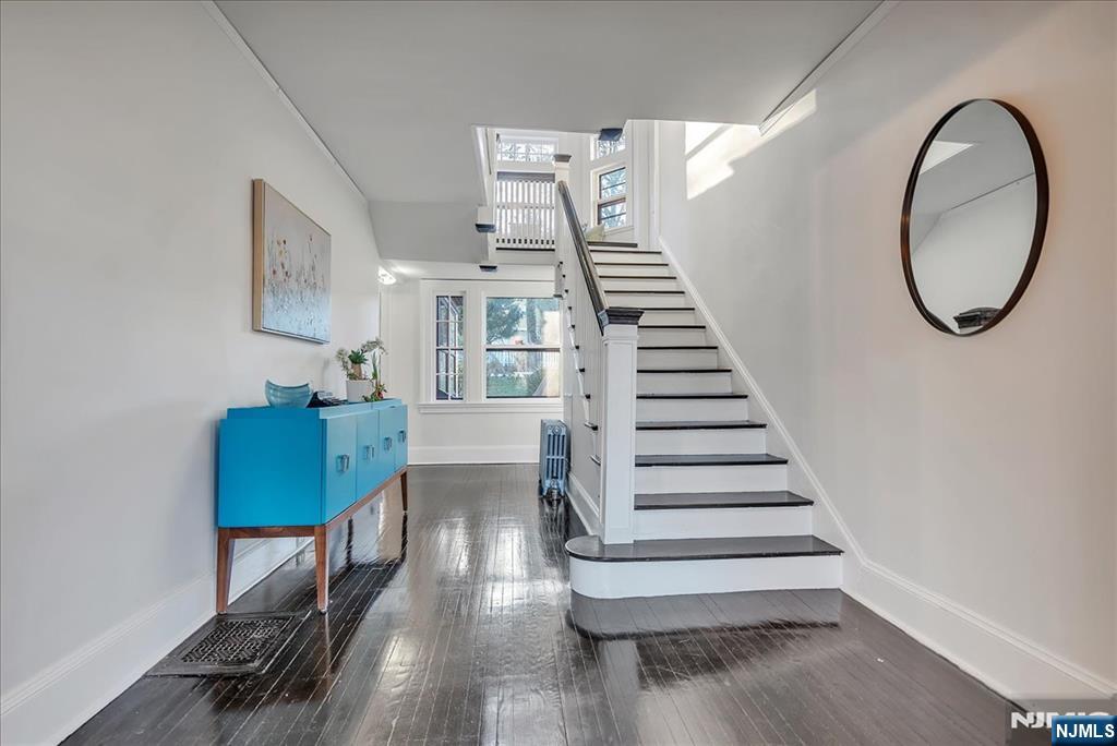 12 Harrison Avenue Montclair, NJ 07042 - Photo 10 of 34 a view of entryway and hall with wooden floor