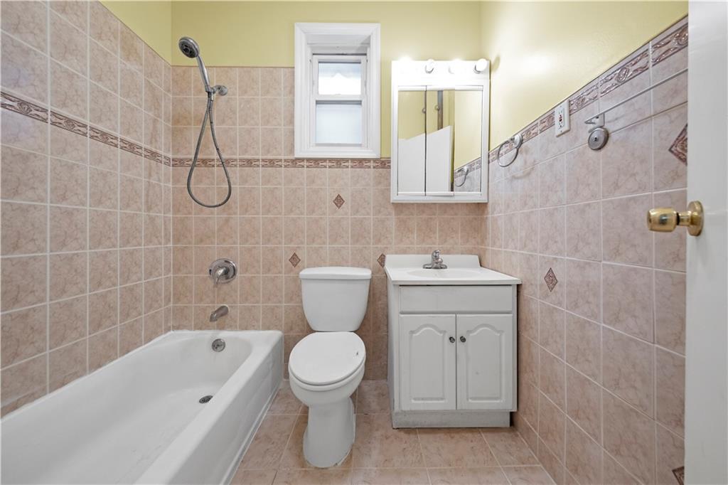 968 St Johns Place Brooklyn, NY 11213 - Photo 12 of 21 a bathroom with a sink toilet and shower