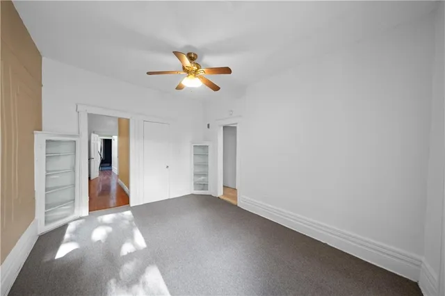 a view of a decorative ceiling fan in a room