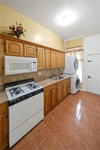 a kitchen with a stove and a sink