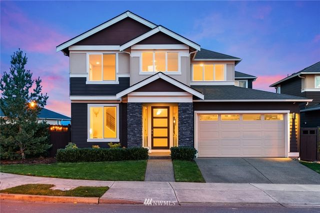 a front view of a house with yard