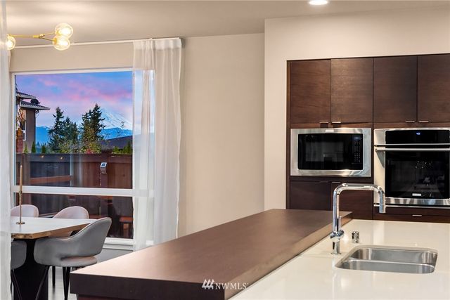 a outdoor dining space with furniture and a potted plant