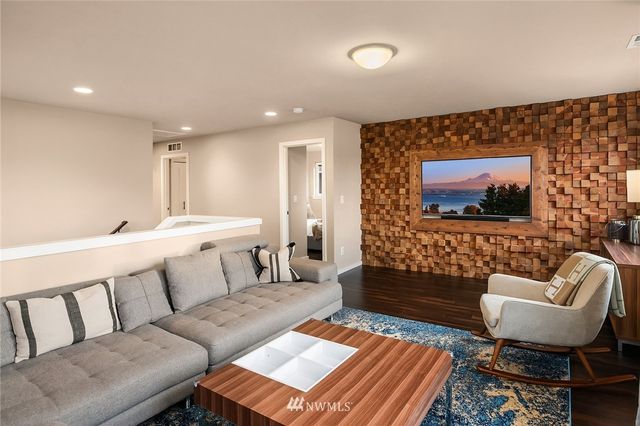 a spacious bathroom with a double vanity sink a large mirror and a bathtub
