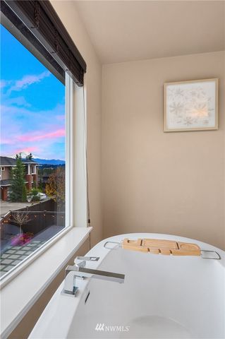 a view of room with wooden floor and windows
