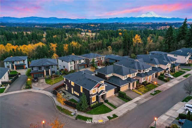 an aerial view of a house with a lake view