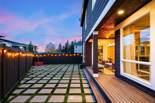 a view of sitting space in the backyard of a house