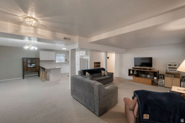 11072 Windy Peak Ridge Drive, Unit 32 Sandy, UT 84094 - Photo 24 of 30 Open-concept lower level featuring plush carpeting throughout