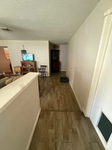 a kitchen with kitchen island a stove a sink and a refrigerator
