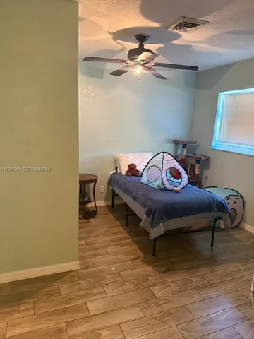 a view of living room with gym equipment
