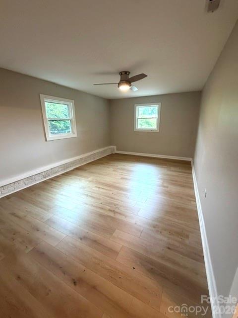 1450 3rd Street Southwest Hickory, NC 28602 - Photo 3 of 17 an empty room with wooden floor and windows