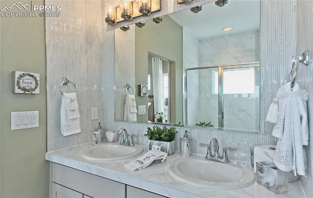 a bathroom with a double vanity sink mirror and double