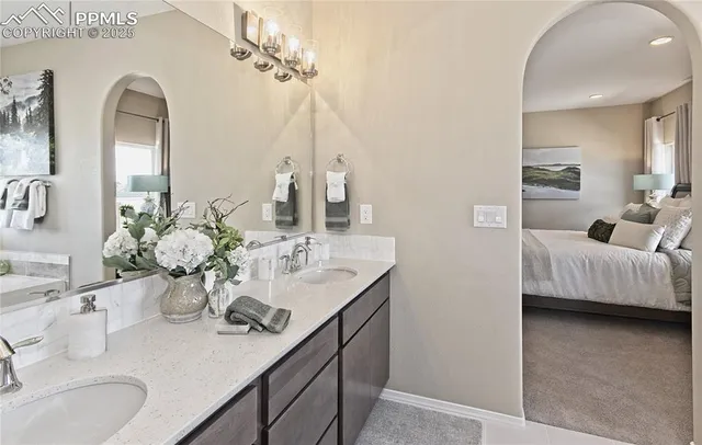 a bathroom with a double vanity sink and a mirror