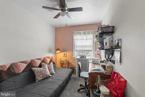 a bedroom with furniture and a window