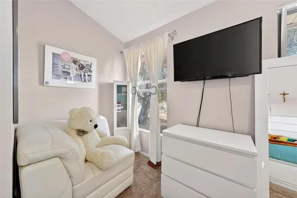 a living room with a couch and a flat screen tv