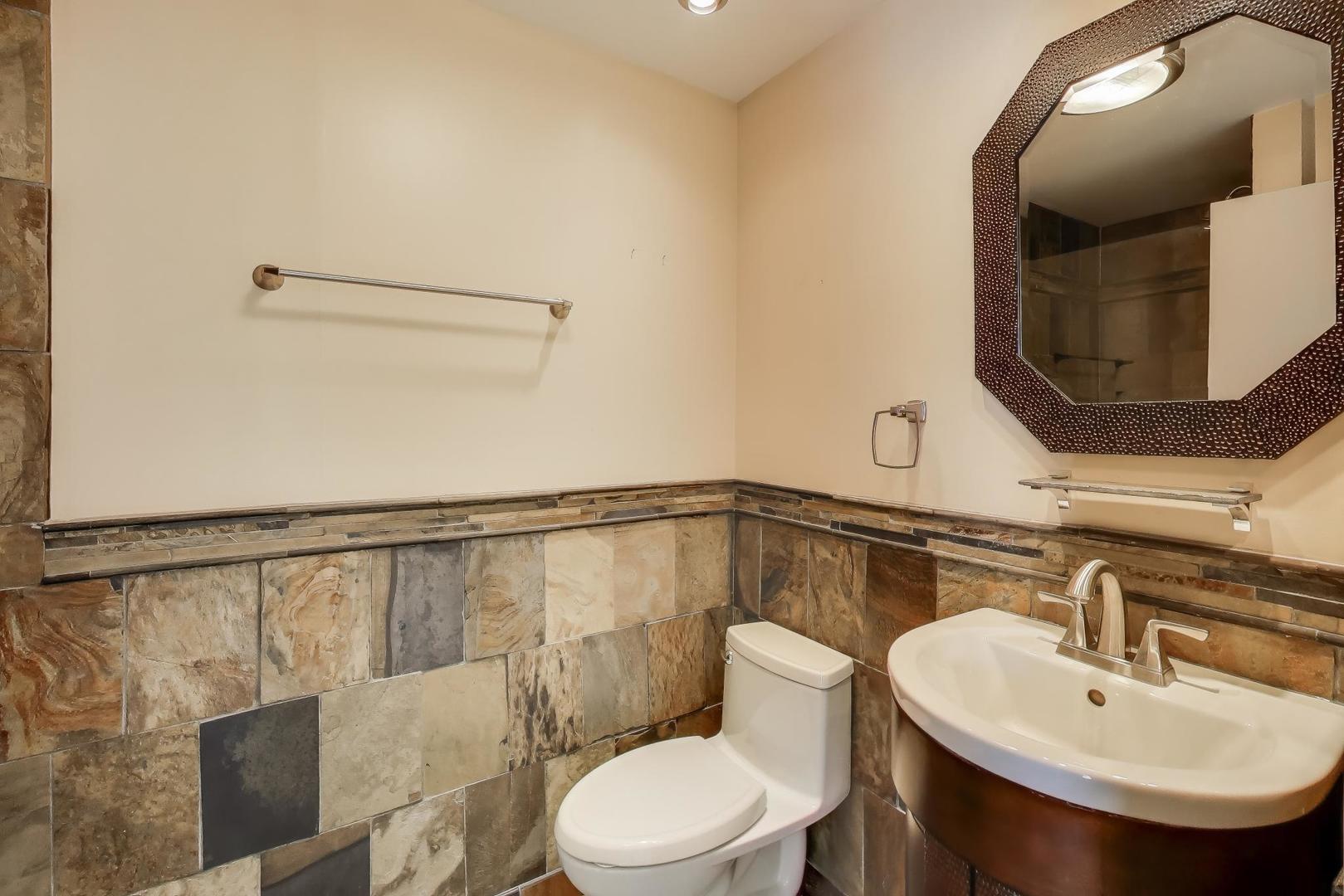 N700 Concord Lane Winfield, IL 60190 - Photo 21 of 31 a bathroom with a sink toilet and mirror