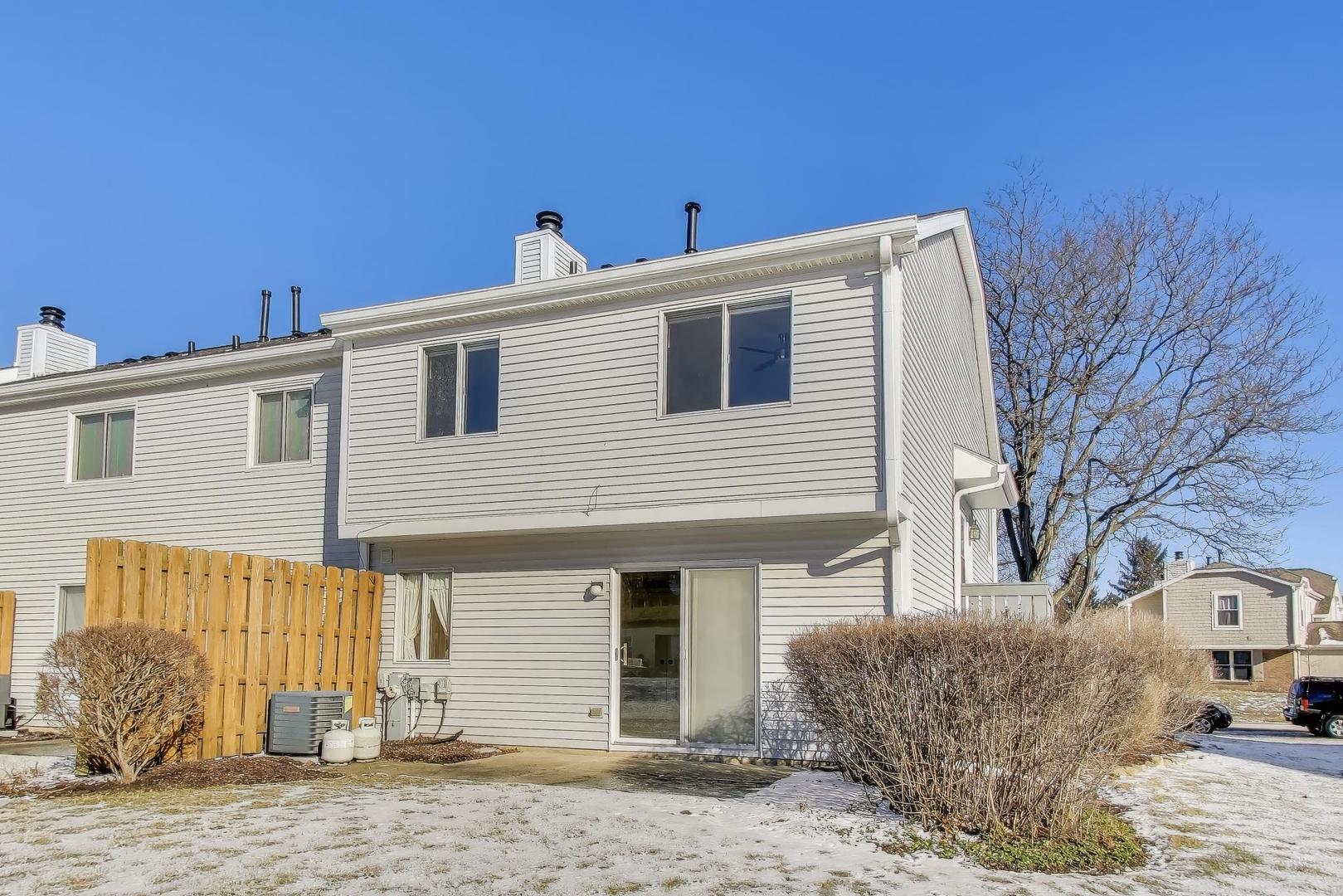 N700 Concord Lane Winfield, IL 60190 - Photo 24 of 31 a front view of a house with a snow