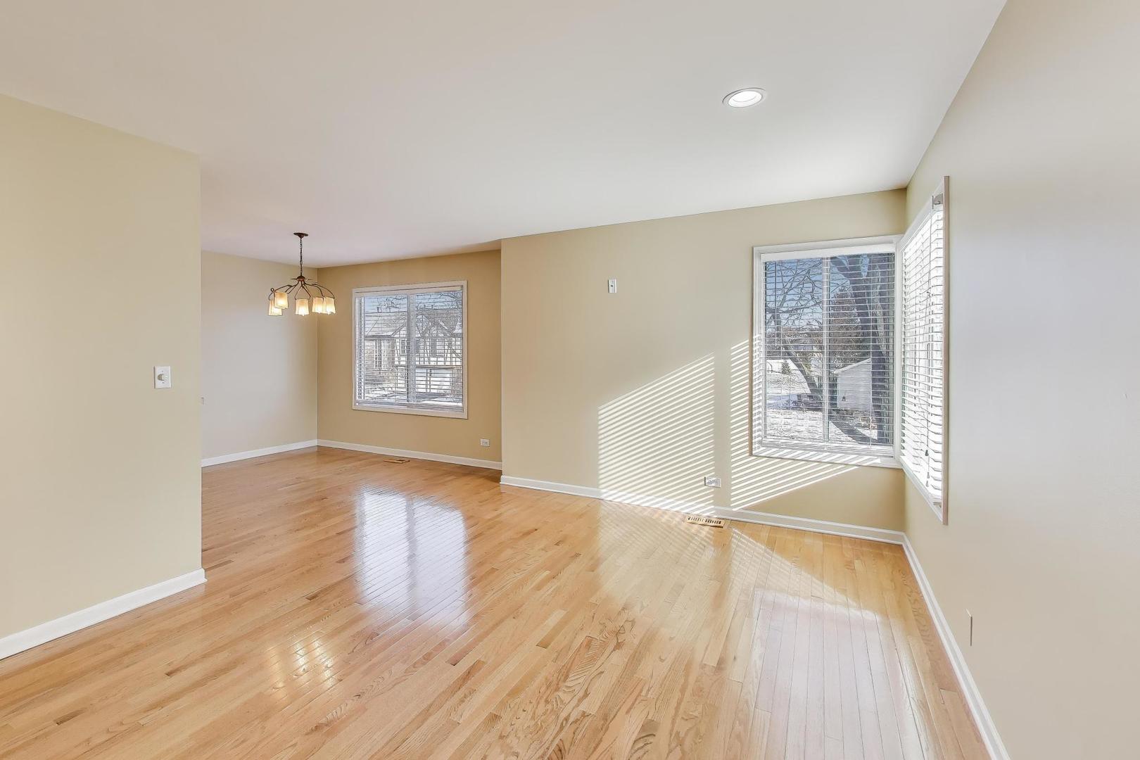 N700 Concord Lane Winfield, IL 60190 - Photo 8 of 31 a view of an empty room with window and wooden floor