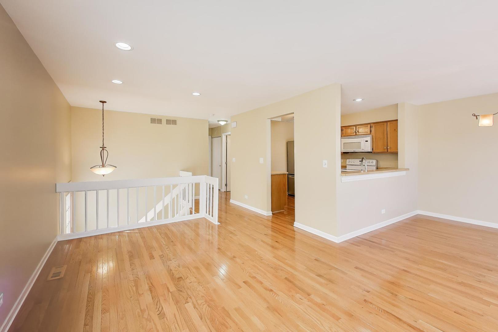 N700 Concord Lane Winfield, IL 60190 - Photo 9 of 31 a view of an empty room with wooden floor
